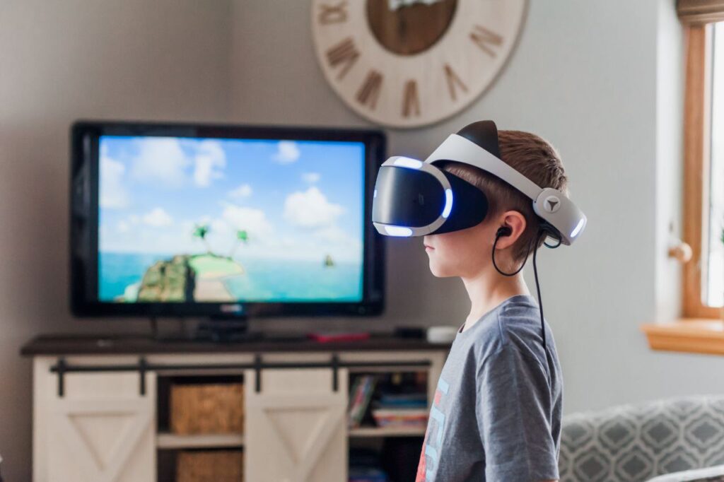 A child engaged with a VR headset in a living room, with a television in the background showing a colorful virtual scene, embodying the intersection of youth and emerging technology.